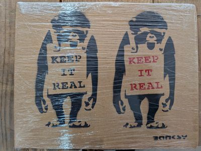 a cardboard box with a picture of two gorillas on it