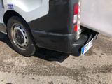 a van with a surfboard on the back of it