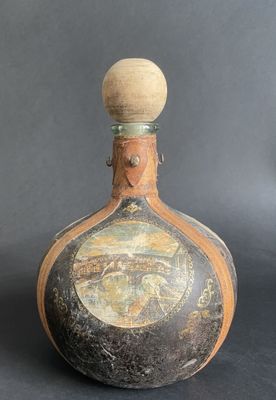 a bottle with a picture on it sitting on a table