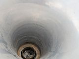 an image of a toilet bowl with a drain in it