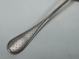 a spoon that has a spoon in it on a table
