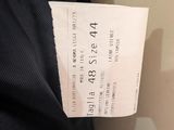 a ticket that is attached to the back of a jacket