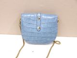 a blue purse that is sitting on a table