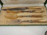 a box with a set of knives and spoons in it