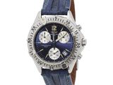 a close up of a wrist watch with a blue dial