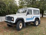a picture of a white land rover parked in the grass