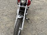 a motorcycle that is parked on the side of the road