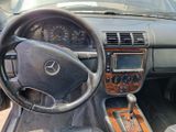 a dashboard of a car with a steering wheel and dashboard controls
