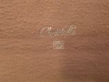 a close up of the back of a brown leather jacket with the name of a man