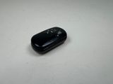 an image of a black mouse on a white surface