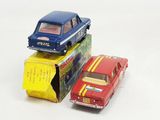 three toy cars are stacked on top of each other on a white surface