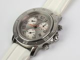 the watch is white and has a silver face