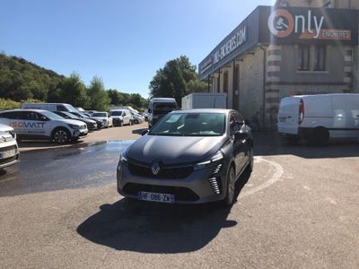 a car parked in front of a building in a parking lot