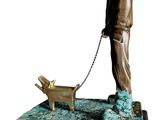 bronze statue of a man with a dog on a leash