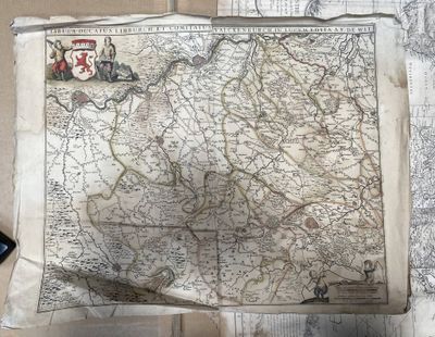 a map on the wall with a cell phone next to it