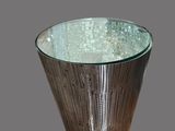 a glass bowl that is sitting on top of a table