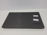 the back of a laptop with a sticker on it sitting on a table