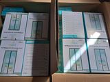 two boxes of electronic devices sitting on top of a cardboard box