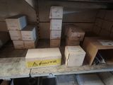 many boxes and boxes on a shelf in a room