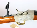 a gun that is on display on a table