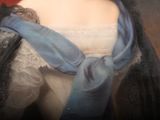 portrait of a woman in a blue dress and a blue scarf