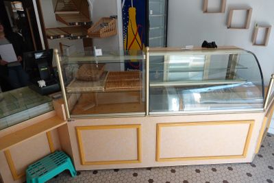 a glass display case in the middle of a room