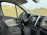 a view of the inside of a vehicle from the driver ' s seat