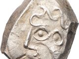 une pièce de monnaie ancienne sur laquelle est gravé le visage d'un homme