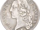 a close up of a coin with a woman ' s face on it
