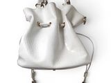 leather bucket bag with tassels on a white background
