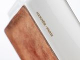 a close up of a white and brown case