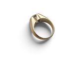 a close up of a gold ring on a white surface