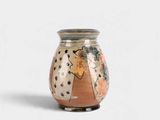 a vase that has a picture of a woman on it