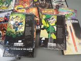 a lot of comic books sitting on a table