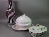 three different types of pottery on display on the table