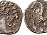 a silver coin with an image of a woman on it