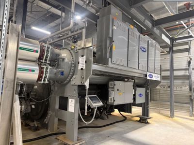 a machine that is inside of a building with a lot of pipes