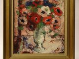 a painting of flowers in a vase on a small easel