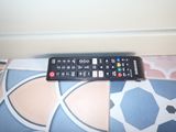 a remote control sitting on top of a bed