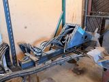 an image of a man working on a machine in a garage
