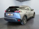 a silver suv parked in a room with a black floor