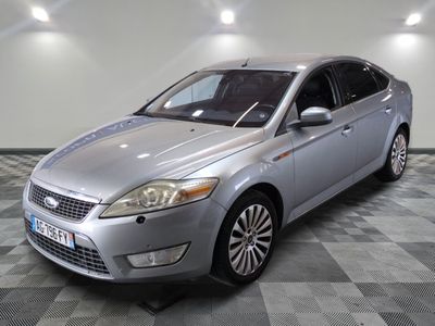a picture of a silver ford monde parked on a checkered floor