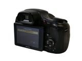 a digital camera that is sitting on a white surface