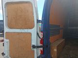 the back of a van with the door open and the back of the van with the door open