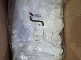 a box that has some white shirts in it