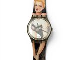 a close up of a watch with a picture of a woman on it