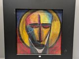 tableau représentant le visage d'un homme avec une croix, dans un cadre noir
