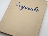 a close up of a book on a table with a white background