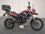 a picture of a red and black motorcycle parked on a checkered floor