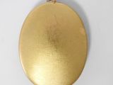 an image of a gold locke with a chain hanging from it ' s side